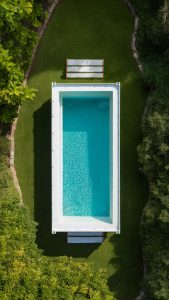 shipping container swimming pool in a small yard