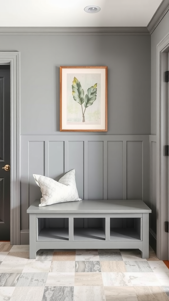 A cozy entryway featuring a gray wall and a framed leaf print above a gray bench with a decorative pillow.