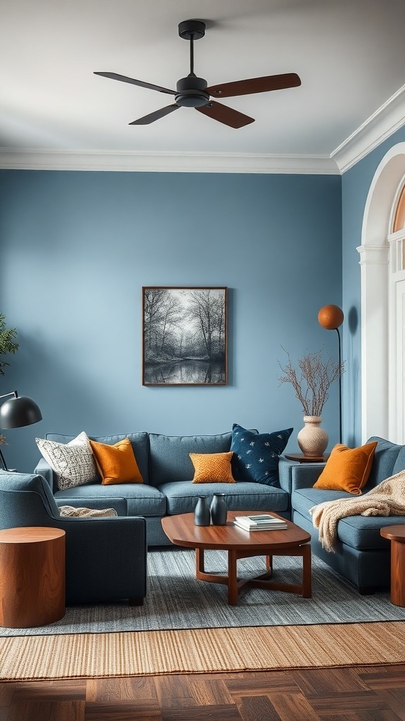 A cozy living room featuring blue walls, a blue sofa with orange cushions, wooden furniture, and a warm atmosphere.
